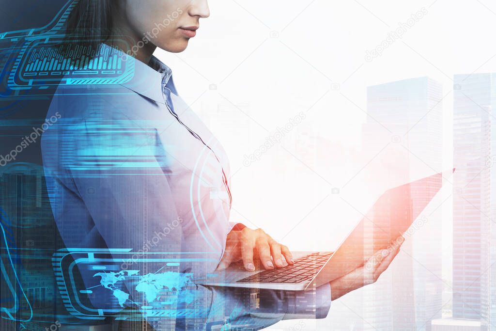 Side view of unrecognizable young businesswoman using laptop in city with double exposure of blurry business interface. Concept of big data and smart city. Toned image