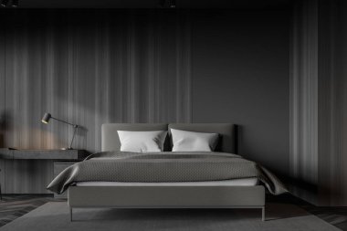 Gri ve koyu ahşap duvarları olan şık bir yatak odası rahat bir kral yatağı ve masa ile ev ofisinin köşesi. 3d oluşturma