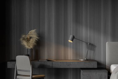 Minimalist, ahşap duvarlı ev ofisinin içi. Yatağın yanında lamba ve sandalye olan rahat bir masa. Evden çalışma kavramı. 3d oluşturma