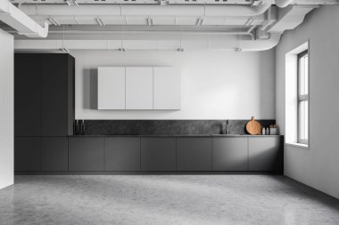 Beyaz ve gri duvarları, beton zemini, gri tezgahları ve beyaz dolapları olan modern endüstriyel mutfağın içi. 3d oluşturma