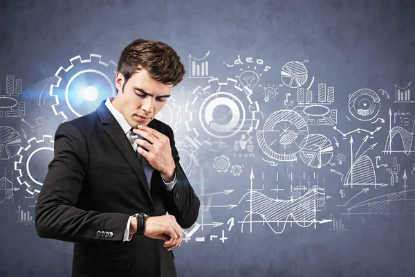 Thoughtful Young European Businessman Looking His Watch Standing Concrete Wall — Stock Photo, Image