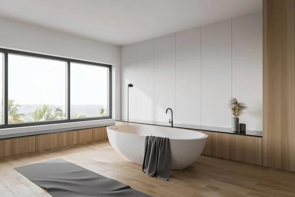 白と木製の壁 木製の床 快適な白いバスタブと窓のあるスタイリッシュなバスルームの隅にぼやけた熱帯の景色 3Dレンダリング — ストック写真