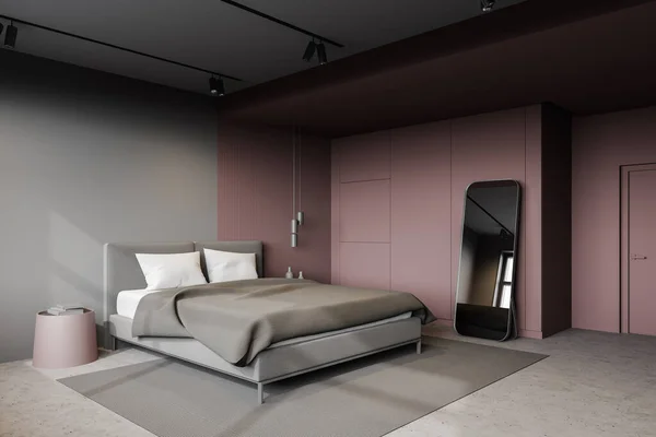 Corner of modern master bedroom with dark red and grey walls, concrete floor, comfortable king size bed and big mirror on the floor. Round bedside tables. 3d rendering