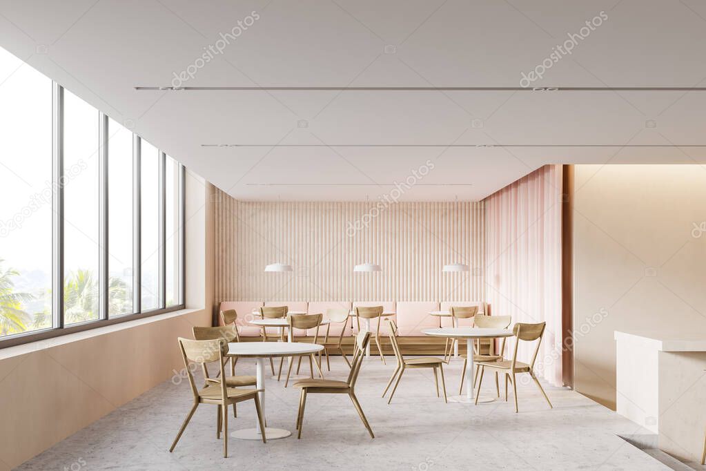 Interior of stylish cafe with beige walls, concrete floor, comfortable sofa and round tables with wooden chairs. Panoramic window with blurry tropical view. 3d rendering
