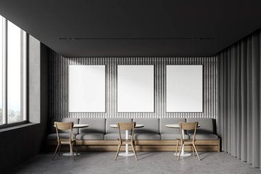Modern çatı katı tarzı kafenin içinde gri duvarları, beton zemini, rahat kanepesi ve sandalyeli yuvarlak masaları olan üç adet dikey maket posterleri asılıydı. 3d oluşturma