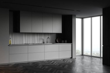 Gri ve ahşap duvarlı ferah minimalist mutfağın köşesi, koyu ahşap zemin, gri dolaplar ve tezgahlar lavabo, fırın ve bulanık manzaralı pencere. 3d oluşturma