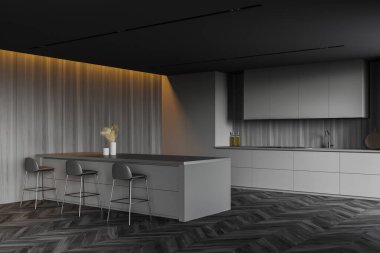 Gri ve ahşap duvarları olan şık bir mutfağın köşesi, koyu ahşap zemin, gri dolaplar ve mutfak tezgahları ve tabureli rahat bir bar. 3d oluşturma