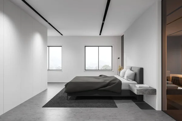 Side view of minimalistic spacious bedroom with white walls, concrete floor, comfortable king size bed and windows with blurry mountain view. 3d rendering