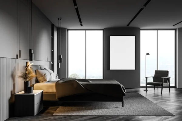 Side view of luxury bedroom with grey walls, dark wooden floor, king size bed and armchair standing near vertical mock up poster. Window with blurry mountain view. 3d rendering