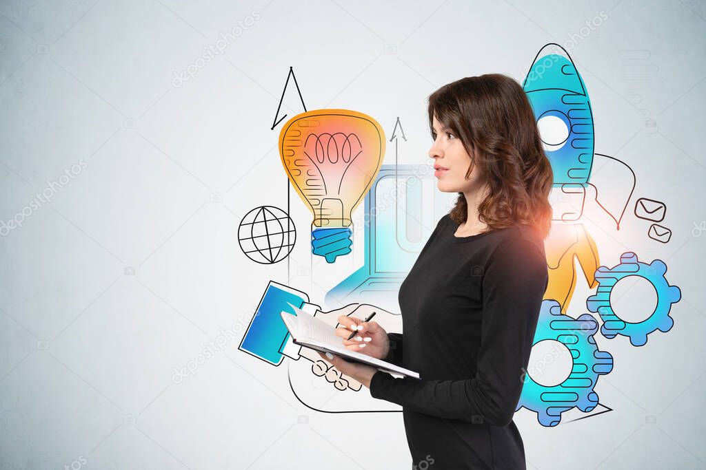 Side view of beautiful young businesswoman in black dress with notebook standing near grey wall with creative startup sketch. Concept of new project launch and planning. Mock up