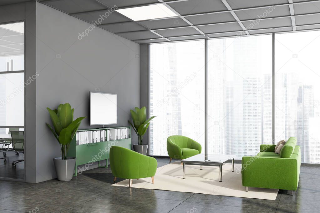 Corner of modern company waiting room with grey walls, tiled floor, comfortable green sofa and armchairs near coffee table and mock up TV screen. Panoramic window with blurry cityscape. 3d rendering
