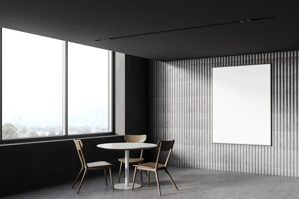 Corner of minimalistic loft coffee shop with grey walls, concrete floor, round table with wooden chairs and vertical mock up poster frame. Window with blurry mountain view. 3d rendering