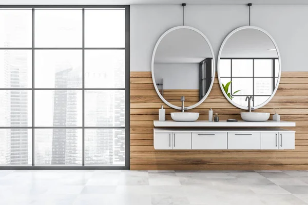 Interior of spacious hotel bathroom with white and wooden walls, tiled floor, comfortable double sink with two oval mirrors and window with blurry cityscape. 3d rendering