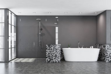 Modern banyo, gri mozaik duvarlar, beton zemin, bulanık şehir manzaralı pencere, sıcak banyo küveti ve rahat cam duş kabini. 3d oluşturma