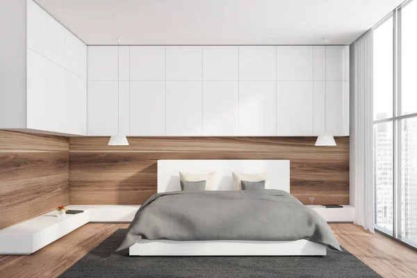 白と木製の壁 木製の床 カーペットの上に灰色の毛布立ってキングサイズベッドと窓のある北欧の寝室のインテリアぼやけた街並み 3Dレンダリング — ストック写真