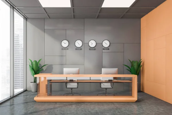 Interior of international company office with gray and orange walls, concrete floor, orange and glass reception desk and time zone clocks. 3d rendering