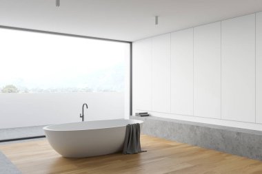 Beyaz duvarlı panoramik banyonun köşesi, beton ve ahşap zemin, rahat küvet ve bulanık dağ manzaralı balkon. 3d oluşturma