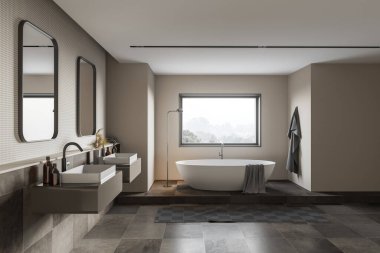 Modern banyo manzarası bej ve fayanslı duvarlar, rahat küvet ve aynalı çift lavabo. Bulanık dağ manzaralı bir pencere. 3d oluşturma