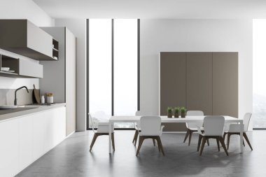 Beyaz duvarları, beton zemini, bej dolapları, beyaz tezgahları ve koltuklu beyaz yemek masası olan modern mutfağın yan görüntüsü. Bulanık dağ manzarası. 3d oluşturma