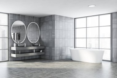 Gri ahşap duvarlı şık banyonun köşesi, iki oval aynalı çift lavabo ve bulanık şehir manzaralı pencerenin yanında duran rahat küvet. 3d oluşturma