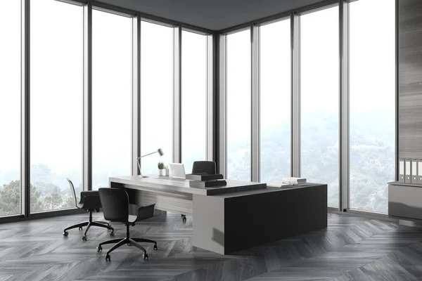 Corner of panoramic CEO office with gray wooden walls, wooden computer desk with chairs for visitors and window with blurry mountain view. 3d rendering