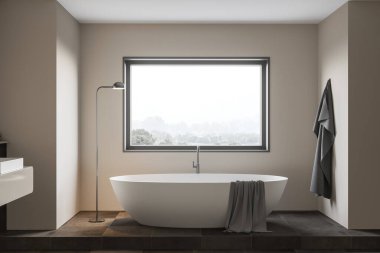 Minimalist banyo, bej duvarlar, fayanslı zemin, pencerenin altında bulanık dağ manzaralı rahat bir küvet. 3d oluşturma