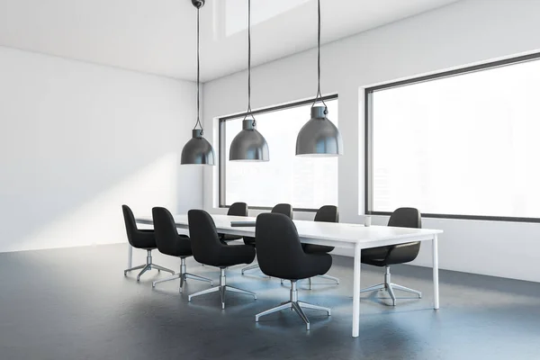 Corner of modern meeting room with white walls, concrete floor, long conference table with black chairs and industrial style lamps. Windows with blurry cityscape. 3d rendering