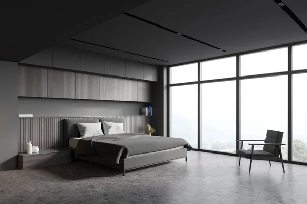 Corner of panoramic master bedroom with grey and wooden walls, concrete floor, king size bed and armchair near window with blurry mountain view. 3d rendering