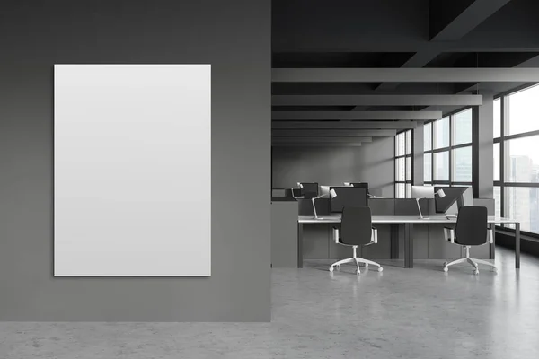 Vertical mock up poster in panoramic open space office with grey walls, concrete floor and rows of white computer tables with black chairs. Window with blurry cityscape. 3d rendering