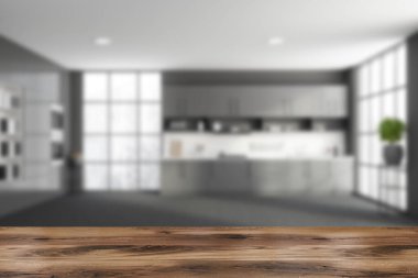 Ürününüz için gri ve beyaz duvarları, beton zemini, rahat gri tezgahları, iki fırını ve kitaplığı olan ahşap bir masa. 3D oluşturma maketi