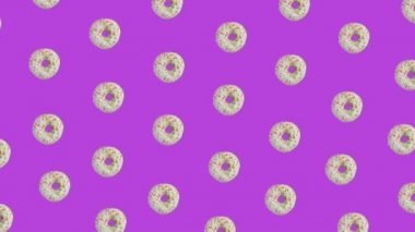 Birçok titreşimli hareketli donut mor arka planda, 3D video animasyonu.