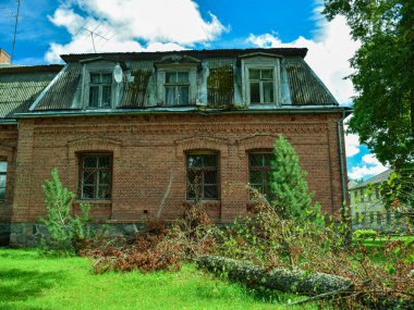 landscape with a manor house and a linden slope in the yard