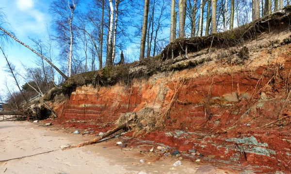Sea, shore and sand, red clay bank, Vidzeme sea shore, Latvia, the Baltic Sea