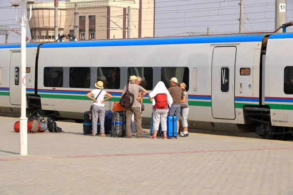 Impressions of the railroad station in Bukhara, one of central transfer places in Uzbekistan for tourists traveling to Samarkand and Tashkent. Text on building means "Welcome" and "Station Bukhara" in — ストック写真