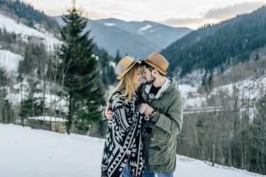 Loving couple hugging at the top of the mountain in the Ukrainian Carpathians