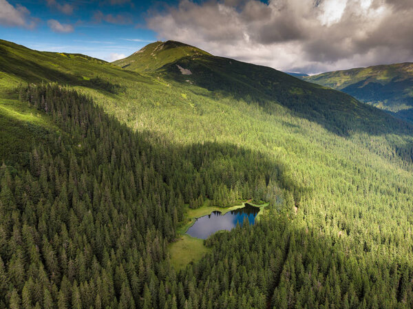 Aerial view ,beautiful lake Maricheika and mountain Pip Ivan in the Ukrainian Carpathians. Drone Ukrainian nature of the beautiful places of the country.