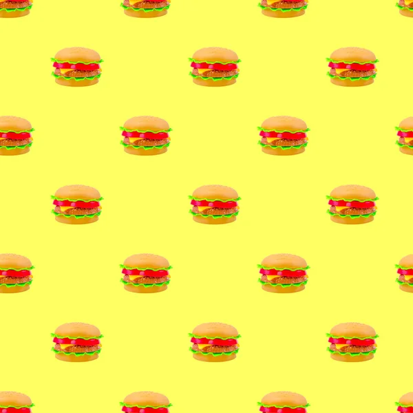 fast food pattern plastic burger on a yellow background
