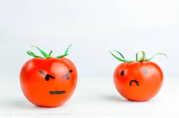 tomatoes with emotions. Relationship. angry and sad.