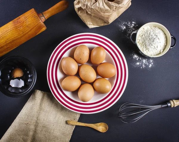 Baking tools and dough ingredients, view from top