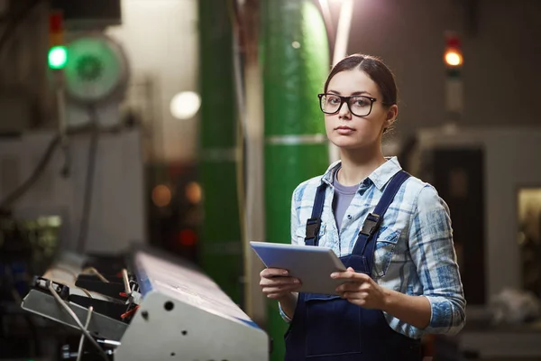 Portrait Female Worker Eyeglasses Overalls Looking Camera While Standing Warehouse — Stok fotoğraf