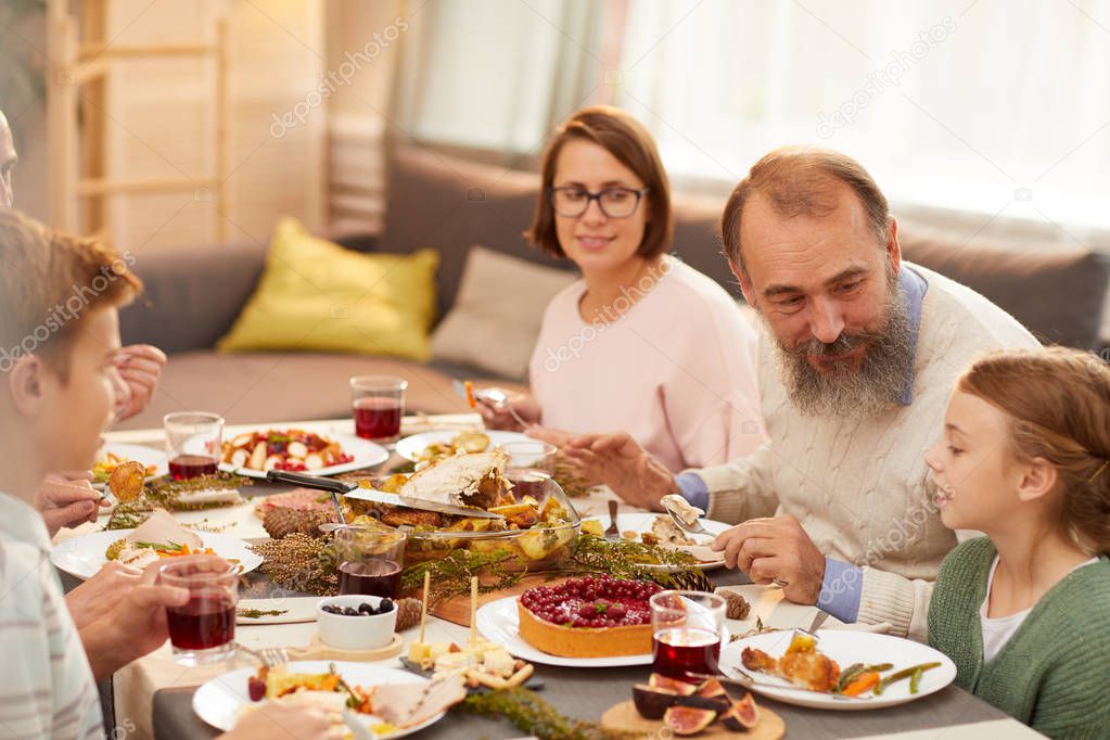 Happy family spending time together during dinner at the table