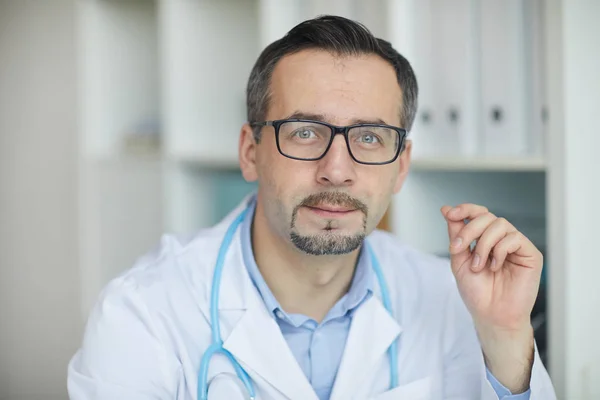 Mature doctor at his office — Stock Photo, Image