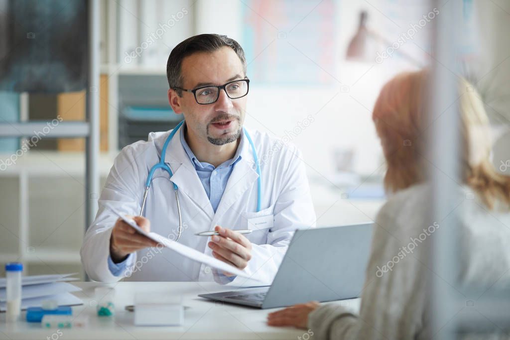Doctor prescribing a treatment to patient