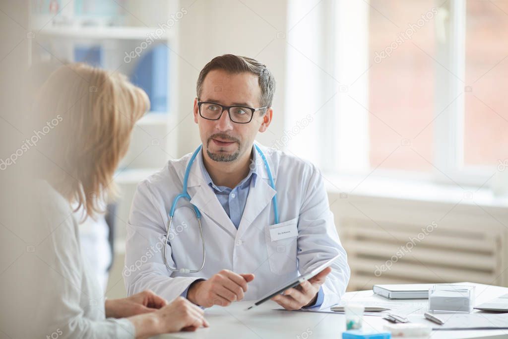 Male doctor with nurse at office