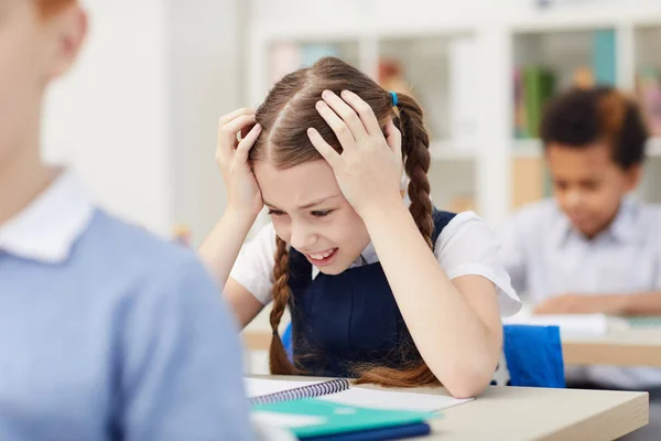 Stresssed schoolgirl at lesson — 스톡 사진