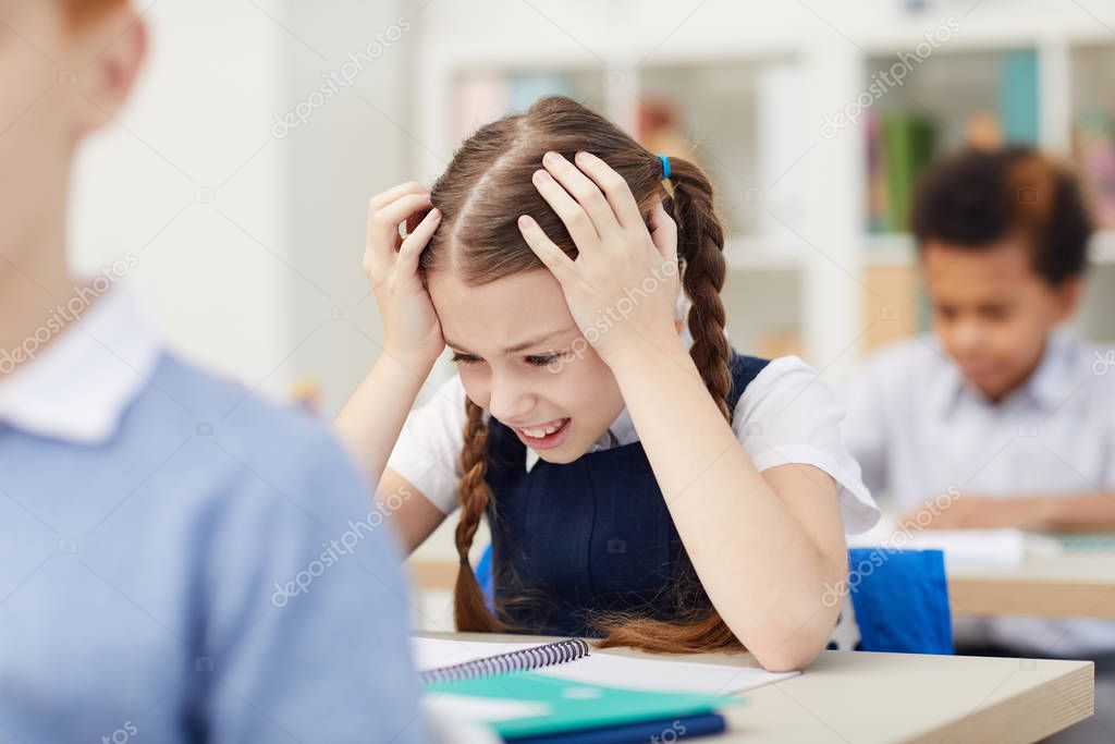 Stresssed schoolgirl at lesson