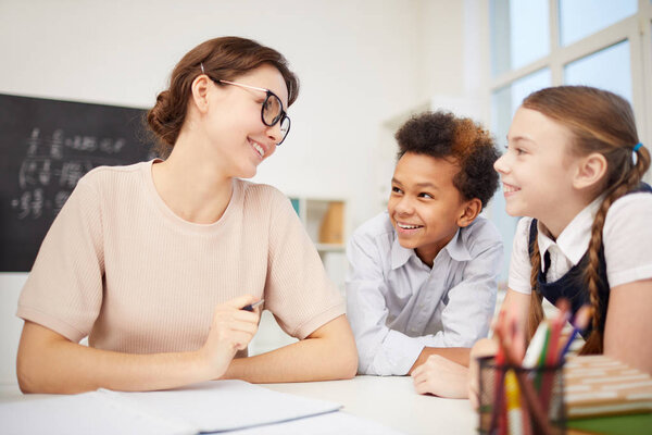 Young teacher with children in the classroom