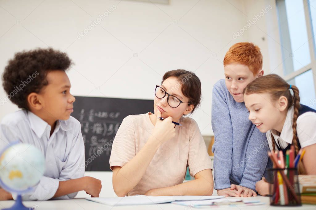 Teacher working with group of students