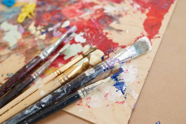 Paintbrushes with paintings