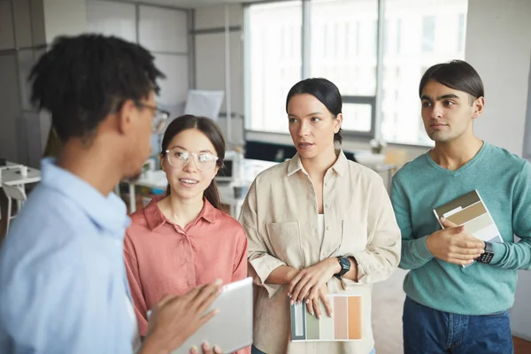 Young business people with their leader — Stock Photo, Image